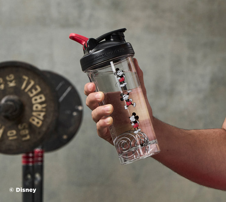pro-series-b2 Mickey_Mouse_Protein_Shaker_Bottle_Being_Held_In_the_Gym.jpg
